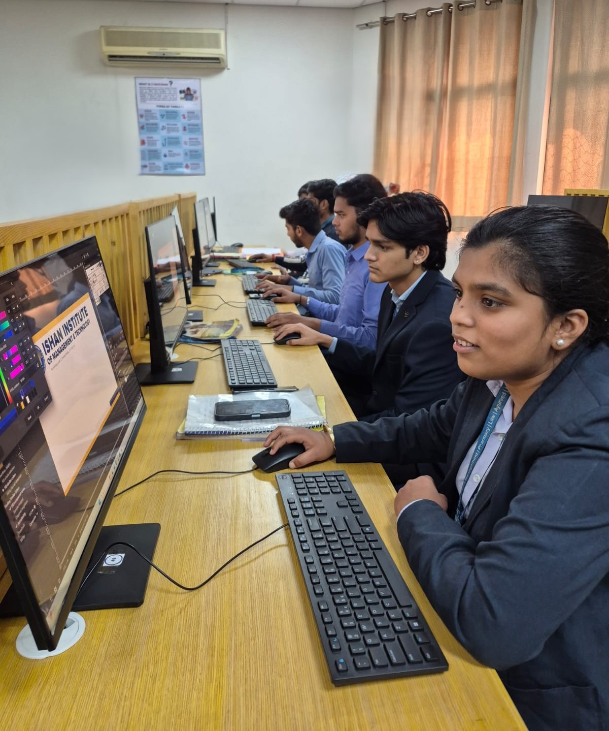 Ishan IIMT BBA students enhancing digital skills through practical computer training. front