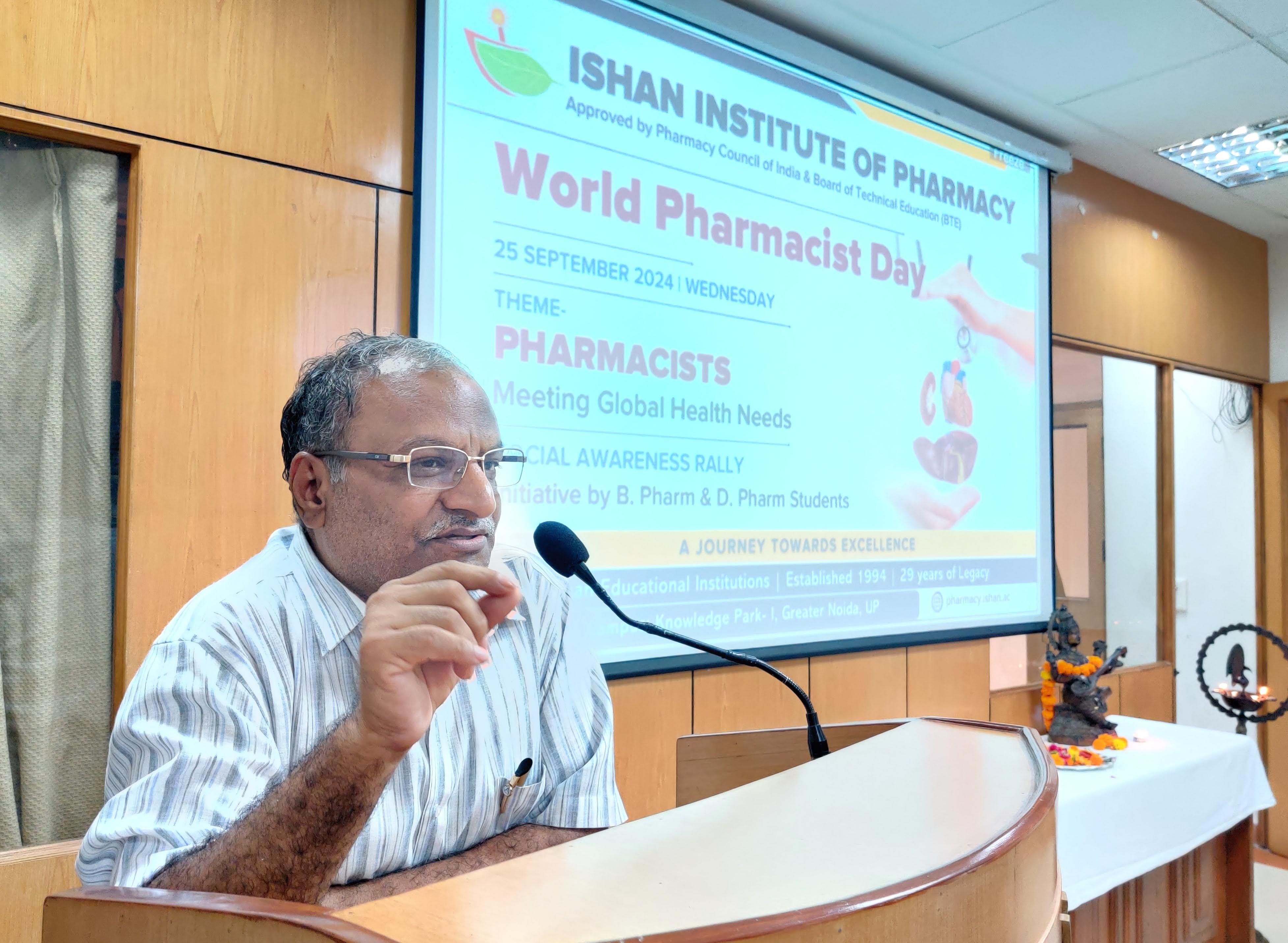 Dr. D.K. Garg, Chairman, motivating Pharmacy students at Ishan Institute of Pharmacy. front