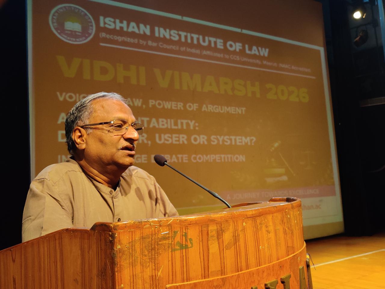 Dr. D.K. Garg addressing law students during the competition at Ishan Institute of Law, Greater Noida.